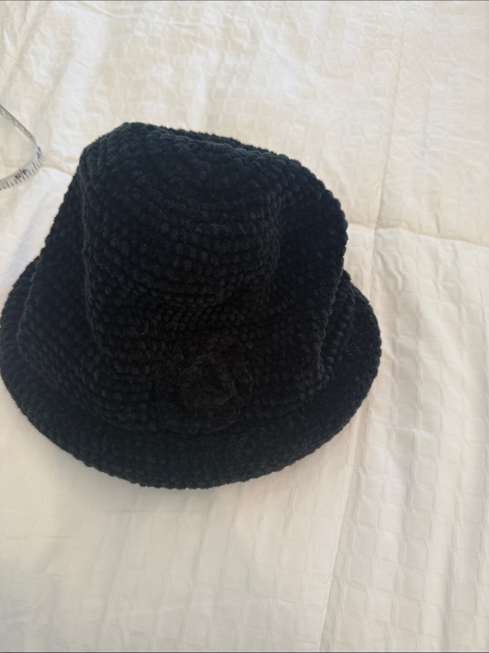 August Hats Black Textured Crochet Bucket Hat with Flower Accent